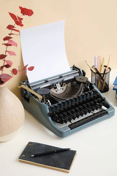 Vintage Typewriter Pencil Holder Notebook Vase Branches Table Beige Wall — Stock Photo, Image