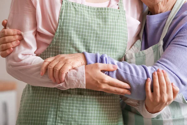 Young Woman Her Grandmother Hugging Kitchen — Stock Photo, Image