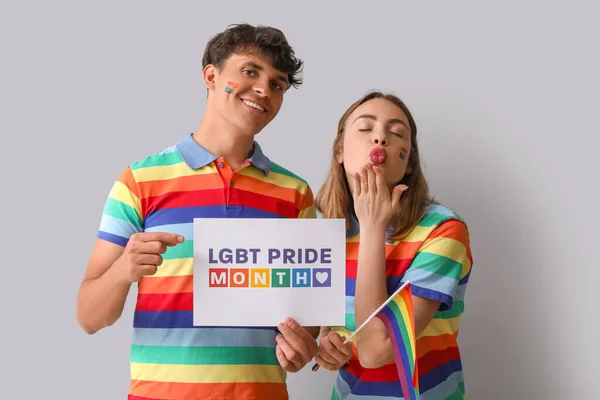 Young Couple Holding Paper Text Lgbt Pride Month Light Background — Stock Photo, Image