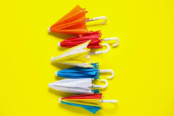 Different Mini Umbrellas Yellow Background — Stock Photo, Image
