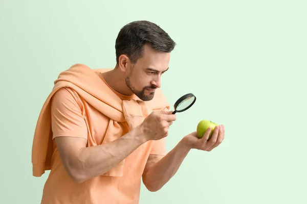 Handsome Man Magnifier Apple Green Background — Stock Photo, Image