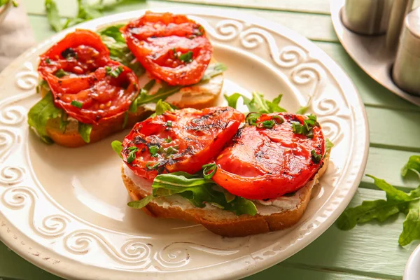 Plate Sandwiches Tasty Grilled Tomatoes Arugula Green Wooden Background — Stock Photo, Image
