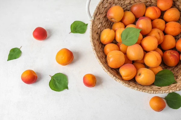 Wicker Basket Fresh Apricots White Table — Stock Photo, Image