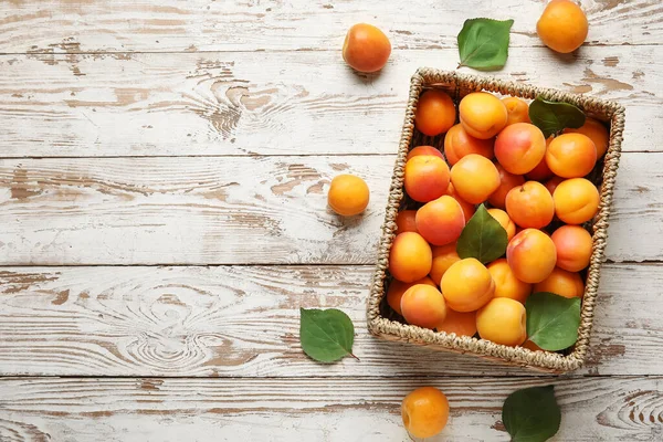Wicker Box Fresh Apricots White Wooden Background — Stock Photo, Image