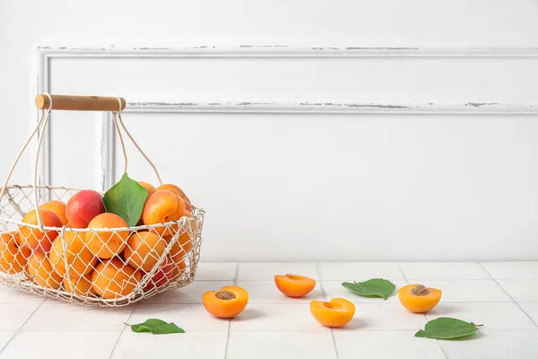 Basket Fresh Apricots White Tile Table — Stock Photo, Image