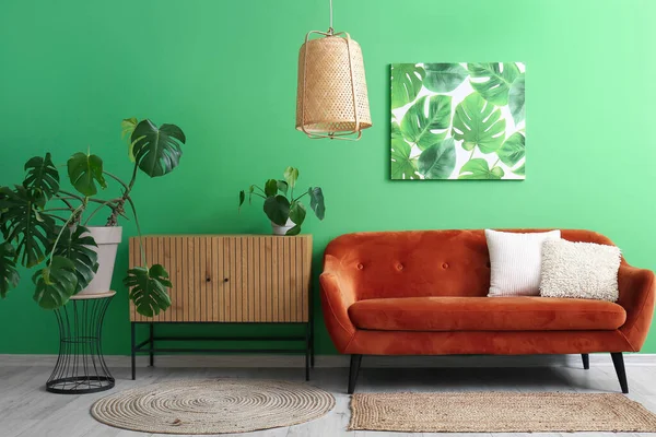 Interior Living Room Brown Sofa Wooden Cabinet Houseplants Green Wall — Stock Photo, Image