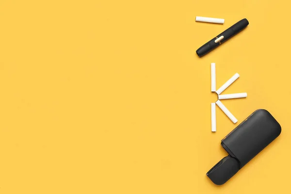 现代电子雪茄和橙色背景的手杖 — 图库照片