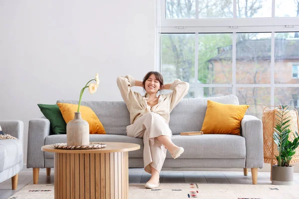 Happy Young Woman Sitting Grey Sofa Interior Light Living Room — Stock Photo, Image