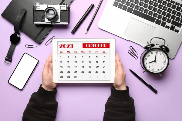Woman Holding Tablet Computer Calendar Different Gadgets Lilac Background — Stock Photo, Image