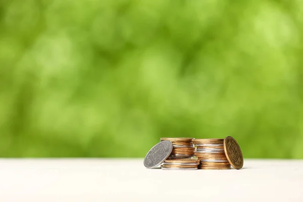 Stacks Coins Table Blurred Green Nature Background — Stock Photo, Image
