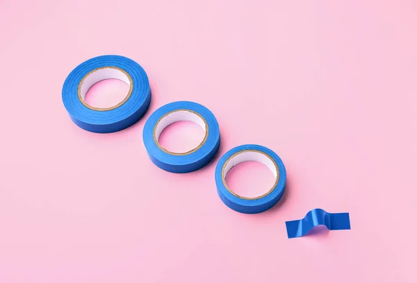 Stock image Adhesive tape rolls on pink background