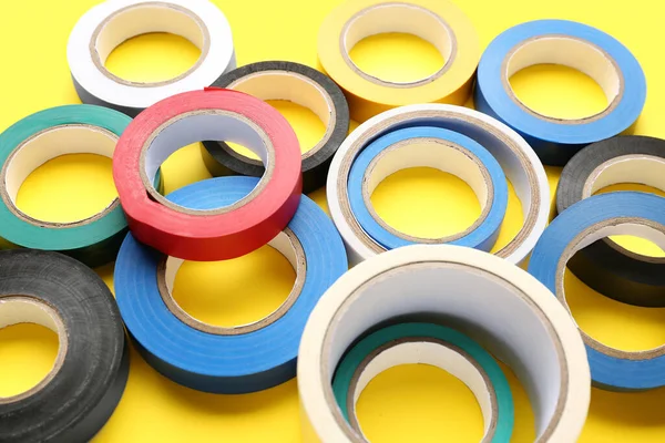 stock image Adhesive tape rolls on yellow background