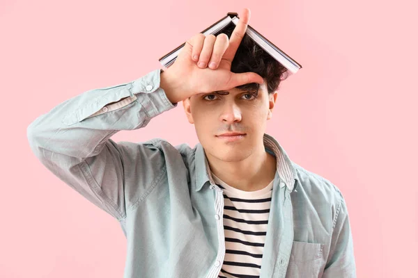 Male Student Book Showing Loser Gesture Pink Background — Stock Photo, Image