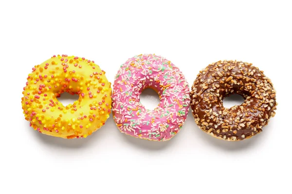 stock image Sweet donuts on white background