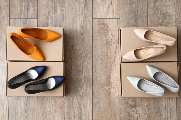 Cardboard Boxes Stylish High Heeled Shoes Light Wooden Background — Stock Photo, Image