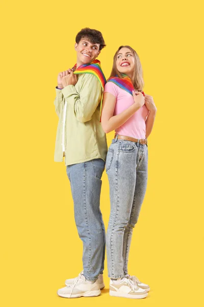 Young Couple Lgbt Flags Yellow Background — Stock Photo, Image