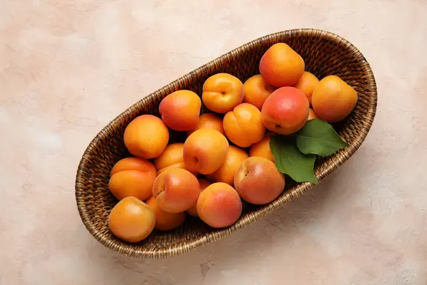Wicker Bowl Fresh Apricots Beige Background — Stock Photo, Image