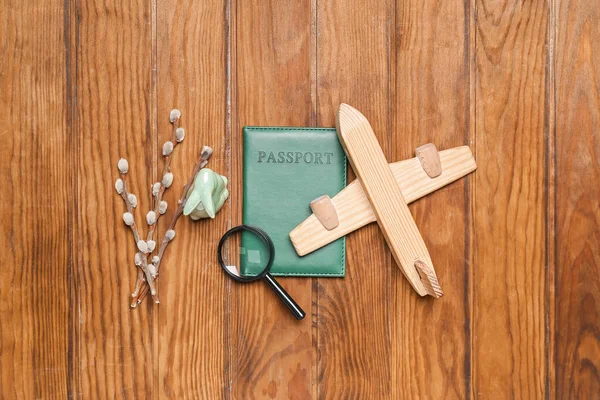 Passport Toy Airplane Magnifier Easter Rabbit Willow Branches Wooden Background — Φωτογραφία Αρχείου