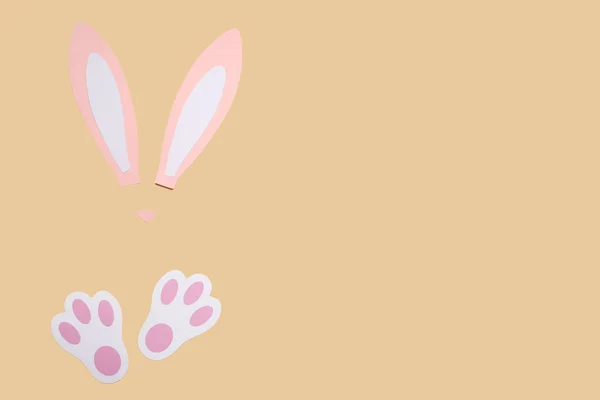 Paper Bunny Ears Paws Yellow Background — Zdjęcie stockowe