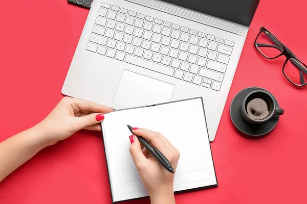 Female Hands Notebook Pen Cup Coffee Eyeglasses Laptop Red Background — Stockfoto