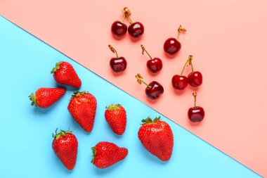 Renkli arka planda taze çilek ve kirazlar