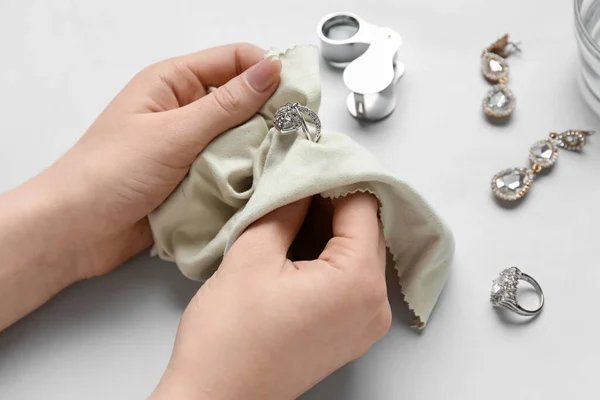 Woman Polishing Beautiful Ring Napkin White Background Closeup — Stock Photo, Image