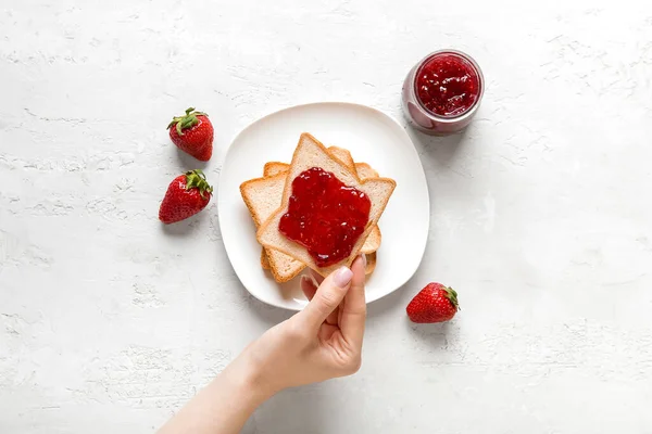 Woman Holding Tasty Toast Strawberry Jam Grunge White Background — Stock Photo, Image