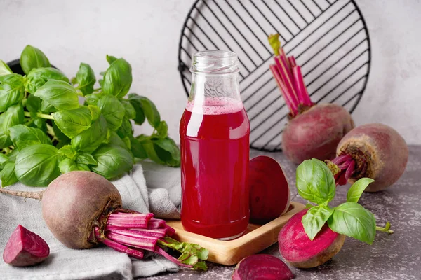 stock image Bottle of fresh beetroot juice and vegetables on table