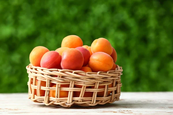 Wicker Bowl Fresh Apricots White Wooden Table Outdoors — Stock Photo, Image