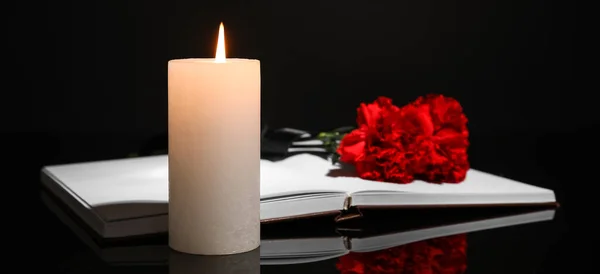 Burning Candle Book Carnation Flowers Dark Background Funeral Concept — Stock Photo, Image