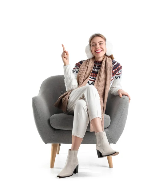 Young Woman Grey Armchair Pointing Something White Background — Stock Photo, Image