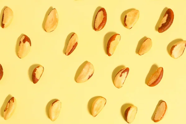 stock image Composition with tasty Brazil nuts on yellow background