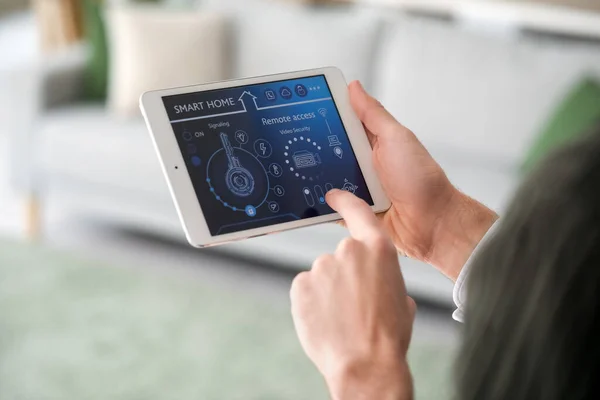 Young Man Using Smart Home Security System Control Panel Closeup — Stock Photo, Image