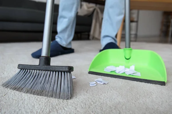 Young Man Sweeping Carpet Broom Home Closeup — Stock Photo, Image