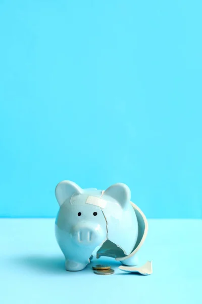 Broken Patched Piggy Bank Money Blue Background Bankruptcy Concept — Stock Photo, Image