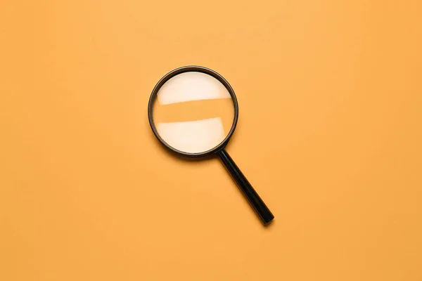 Black Magnifier Orange Background — Stock Photo, Image