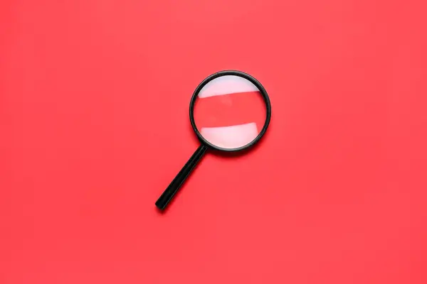 Black Magnifier Red Background — Stock Photo, Image