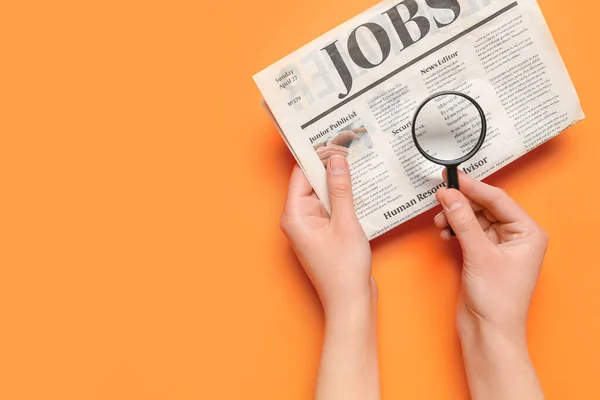 Female Hands Mini Magnifier Newspaper Headline Jobs Orange Background Search — Stock Photo, Image