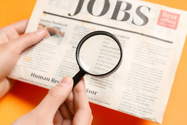 Female Hands Mini Magnifier Newspaper Headline Jobs Orange Background Search — Stock Photo, Image