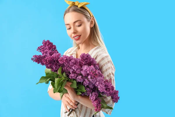Young Woman Lilac Flowers Blue Background — Stock Photo, Image