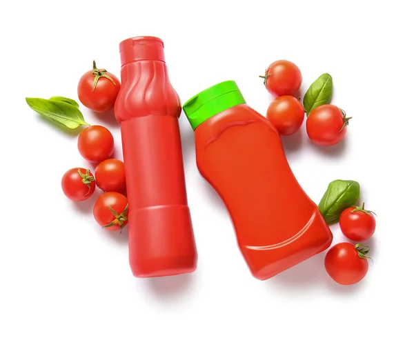 stock image Bottles of ketchup and tomatoes on white background