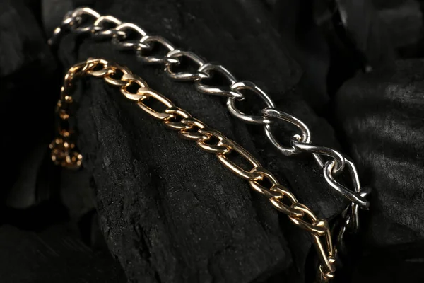 Beautiful Chain Bracelets Black Charcoal Closeup — Stock Photo, Image