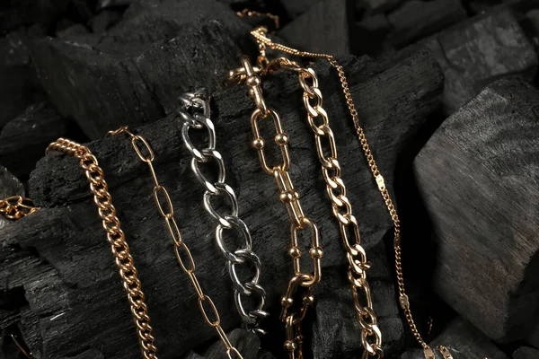 Beautiful Chain Bracelets Necklaces Black Charcoal Closeup — Stock Photo, Image