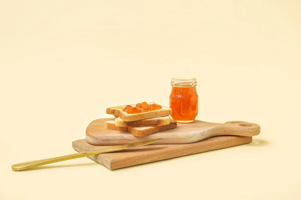 Wooden Boards Tasty Toasts Apricot Jam Knife Pale Yellow Background — Stock Photo, Image