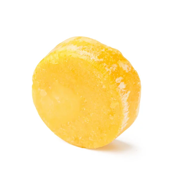 白い背景に黄色の固体シャンプーバー — ストック写真