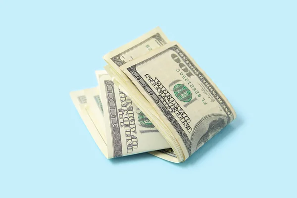 stock image One hundred dollar banknotes on blue background