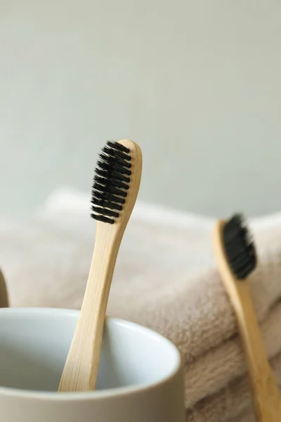 Bamboo Tooth Brushes Towels Grey Background Closeup — Stock Photo, Image