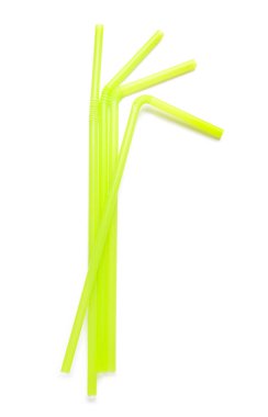 beyaz zemin üzerine yeşil plastik çubuk