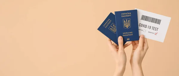 Female Hands Ukrainian Passports Negative Covid Test Result Beige Background — Stock Photo, Image