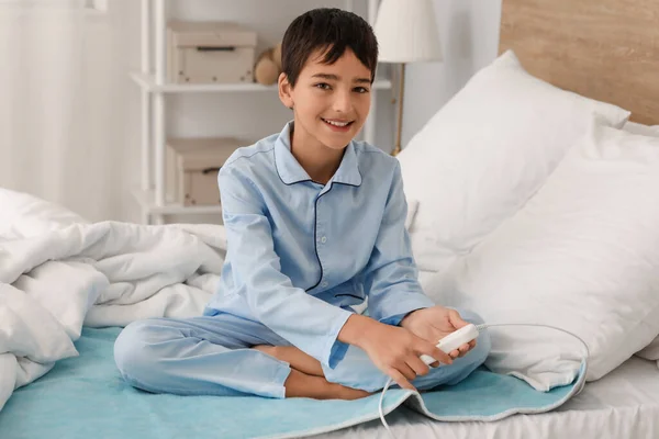 Little Boy Sitting Electric Heating Pad Bedroom — Stock Photo, Image